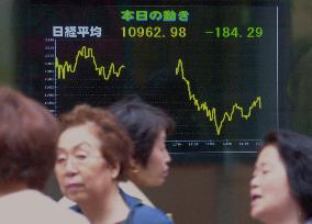 Tokyo stocks tumble on Wall Street fall